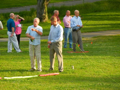 Fish Fry - David English coaching Steve Skakandy - Vic Skakandy doing distance casting in the background
